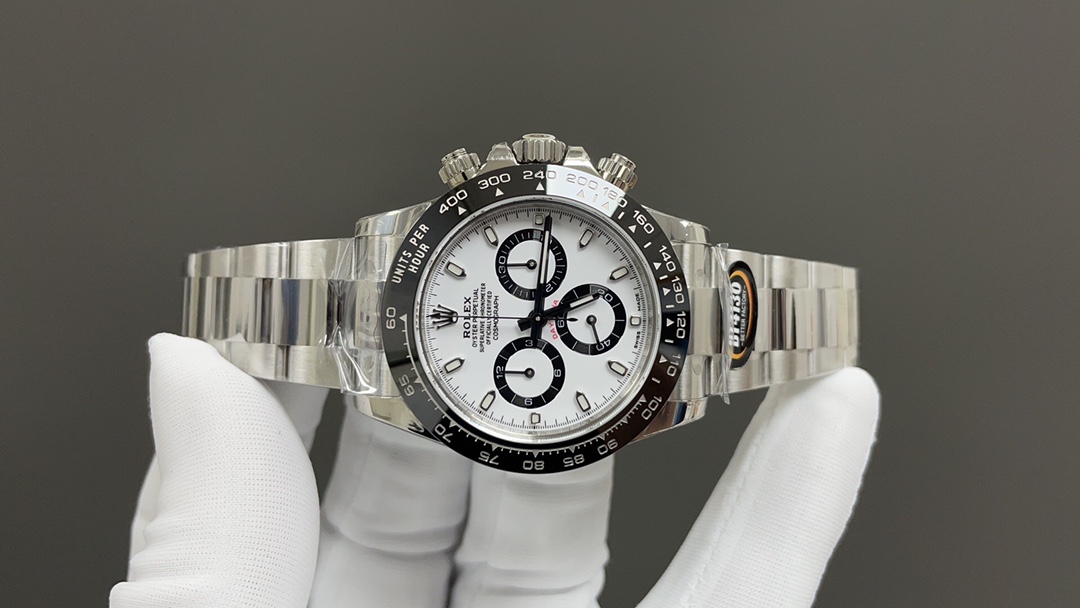 Rolex Daytona panda side on white gloves