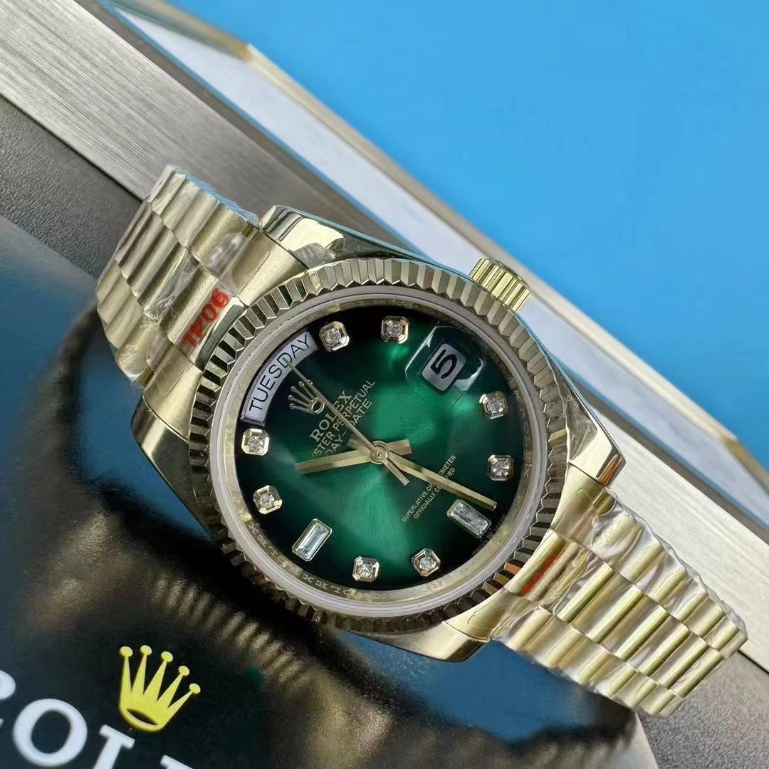 Rolex Day-Date Green Dial Gold Strap 118238 on its side on the table