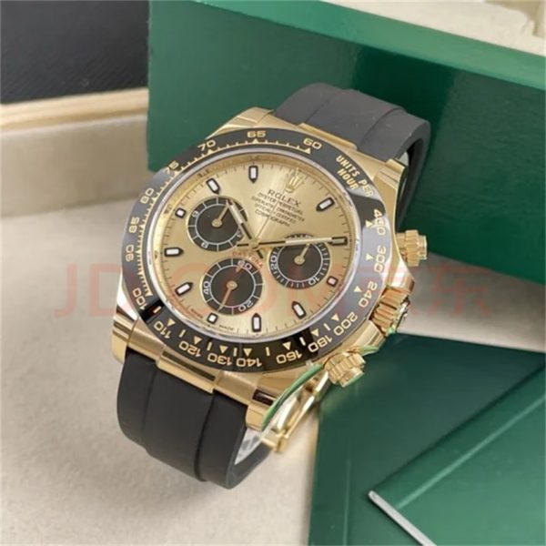 Rolex Cosmograph Daytona (Rolex Cosmograph Daytona) gold dial front placed next to Rolex green box